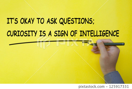 It is okay to ask questions, curiosity is a sign of intelligence text written on yellow cover background. Inspirational and motivational concept. It is okay to ask questions, curiosity is a sign of intelligence text written on yellow cover background. Inspirational and motivational concept. 125917331