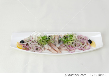 herring Set with delicious salted herring fillets on white background, top view 125918459