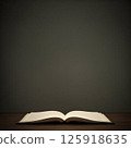 An opened book isolated on a gray background with copy space for your work. 125918635