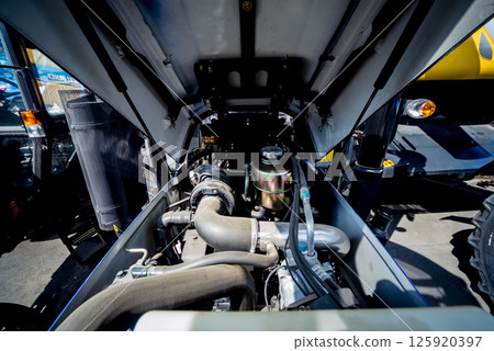 Modern new agricultural tractor engine. Machinery and equipment 125920397