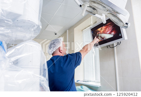 Modern surgical system. Medical robot. Minimally invasive robotic surgery. Modern surgical system. Medical robot. Minimally invasive robotic surgery. 125920412