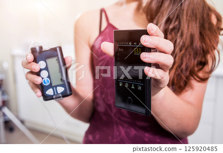 Medical device for glucose check. Continuous glucose monitoring pod. Modern wireless technology. 125920485