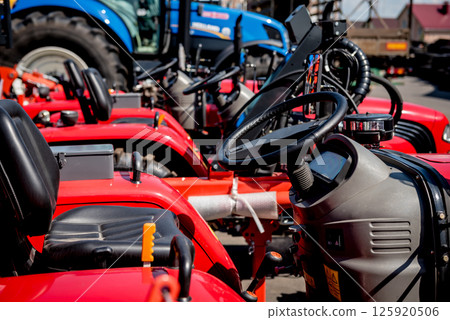 Rows of modern tractors. Industrial details. Agricultural Rows of modern tractors. Industrial details. Agricultural 125920506