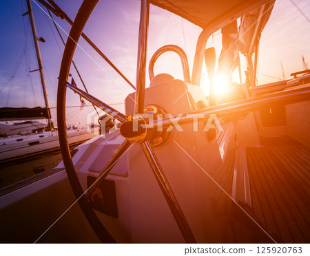 A modern speed boat yacht steering wheels. 125920763