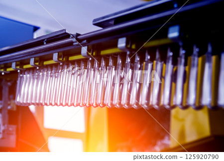 The plastic bottle blowing machine. PET preforms for blowing of plastic bottles.  125920790
