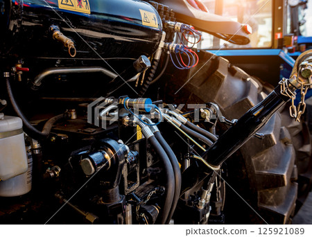 Rear view of modern agricultural tractor. Industrial details. Rear view of modern agricultural tractor. Industrial details. 125921089