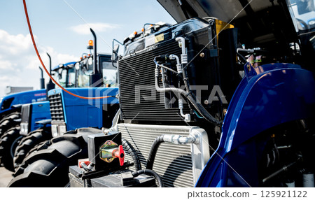 Modern new agricultural tractor engine. Machinery and equipment 125921122