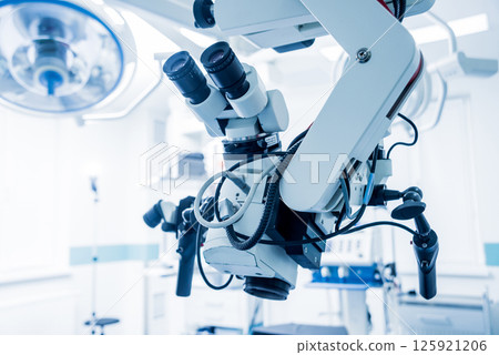 Modern microscope for operations in surgery room at the hospital. Modern microscope for operations in surgery room at the hospital. 125921206