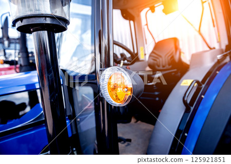 Modern tractor cabin interior. Agricultural exhibition. Industrial Modern tractor cabin interior. Agricultural exhibition. Industrial 125921851