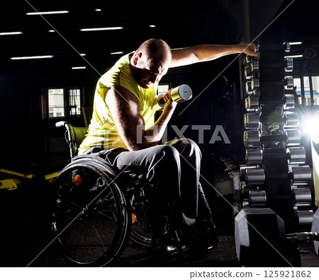 Disabled man training in the gym of rehabilitation center 125921862
