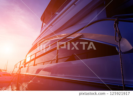 View of harbor with yachts details. Beautiful sunset sky in the marina bay. 125921917