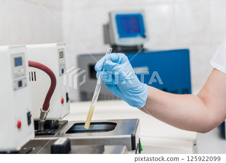 Natural oil quality control. In the industrial laboratory. 125922099