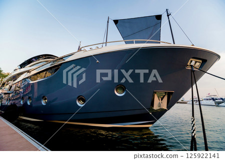 Beautiful view of marina and harbor with yachts and motorboats. 125922141