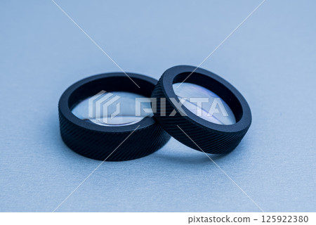 Indirect ophthalmoscopy lens on the grey table. 125922380