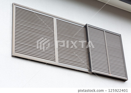 A second-floor window with shutters closed in a Japanese house 125922401