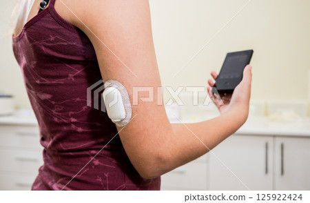 Medical device for glucose check. Continuous glucose monitoring pod. Modern wireless technology. 125922424