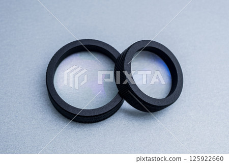Indirect ophthalmoscopy lens on the grey table. 125922660
