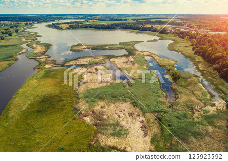 Top view of the river floodplain on a sunny summer day Top view of the river floodplain on a sunny summer day 125923592