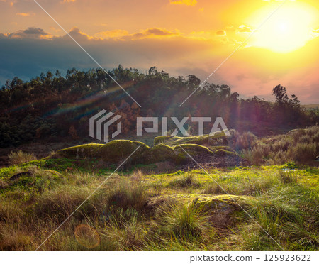Rocky landscape with many big stones and boulders at sunset. Belmonte, Portugal Rocky landscape with many big stones and boulders at sunset. Belmonte, Portugal 125923622