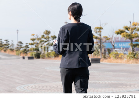 A young woman in a suit A young woman in a suit 125923791