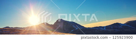 Mountain landscape with blue clear sky during sunset in autumn. The Pyrenees Mountains In Andorra. Horizontal banner 125923900