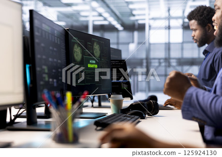 Developer receiving access granted notification while reconfiguring server farm, optimizing it. Worker ensures data center operates efficiently, happy after successfully eliminating all errors Developer receiving access granted notification while reconfiguring server farm, optimizing it. Worker ensures data center operates efficiently, happy after successfully eliminating all errors 125924130