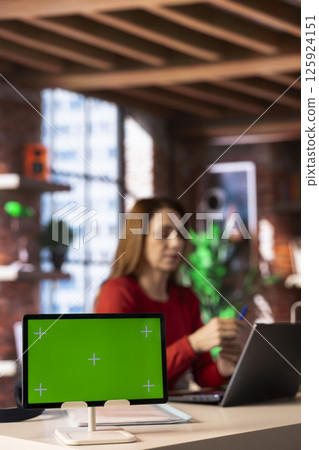 Person uses laptop for creative projects next to isolated copy space, creating designs while staying connected to the freelance platform. Woman focusing on research and multitasking. Person uses laptop for creative projects next to isolated copy space, creating designs while staying connected to the freelance platform. Woman focusing on research and multitasking. 125924151