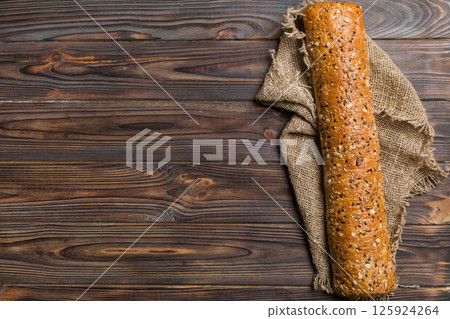 fresh crunchy french baguette on colored table. Top view Bakery products 125924264