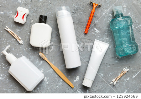 Mockup for bathing products top view flat lay, spa razor, toothpaste, soap, gel and other various accessories. Cosmetics for skin health. Bath Mockup for your logo 125924569