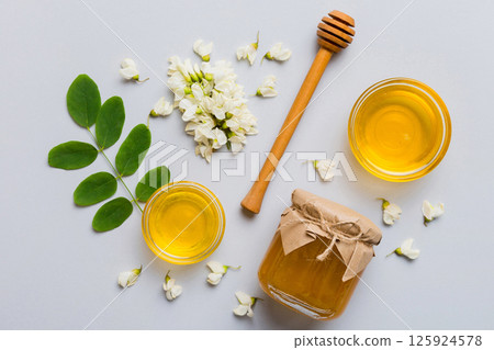 honey jar with acacia flowers and leaves. fresh honey top view flat lay 125924578