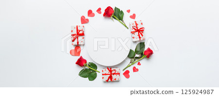 Frame made of rose, git box, heart and blank greeting card mockup on Colored background. Top view, flat lay, copy space Holiday, Mothers Day, birthday concept Frame made of rose, git box, heart and blank greeting card mockup on Colored background. Top view, flat lay, copy space Holiday, Mothers Day, birthday concept 125924987