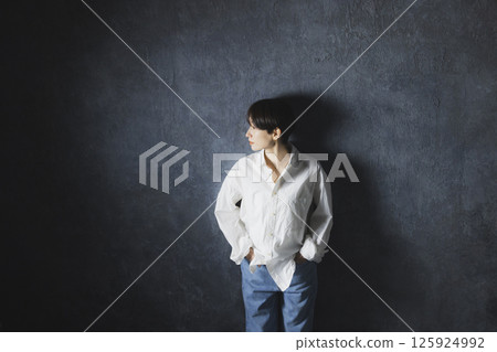 A woman with a white shirt A woman with a white shirt 125924992