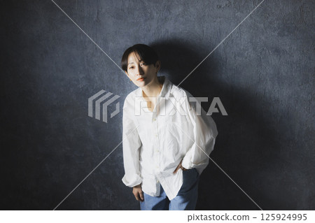 A woman with a white shirt A woman with a white shirt 125924995