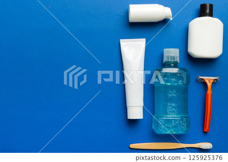 Composition with bath cosmetics on table. razor, toothpaste, soap, gel, toothbrush, mouthwash and other various accessories. Cosmetics for skin health. Bath Mockup for your logo Composition with bath cosmetics on table. razor, toothpaste, soap, gel, toothbrush, mouthwash and other various accessories. Cosmetics for skin health. Bath Mockup for your logo 125925376
