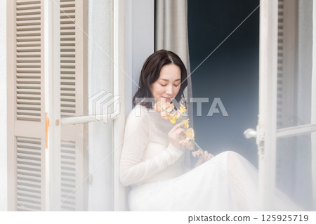 A woman with flowers 125925719