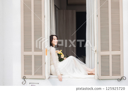 A woman with flowers 125925720