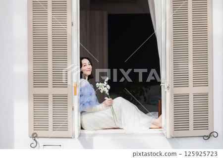 A woman with flowers 125925723