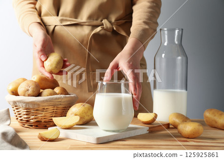 Potato milk, concept of fresh and healthy drink Potato milk, concept of fresh and healthy drink 125925861