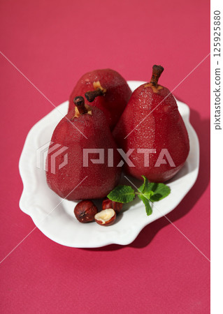 Tasty and delicious food concept - pear in wine Tasty and delicious food concept - pear in wine 125925880