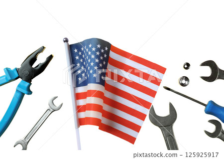 Tools and an American flag are arranged to celebrate Labor Day, isolated on white Tools and an American flag are arranged to celebrate Labor Day, isolated on white 125925917