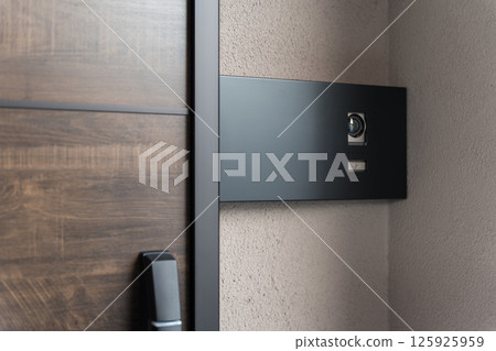 Intercom, door phone, and doorbell at the entrance 125925959