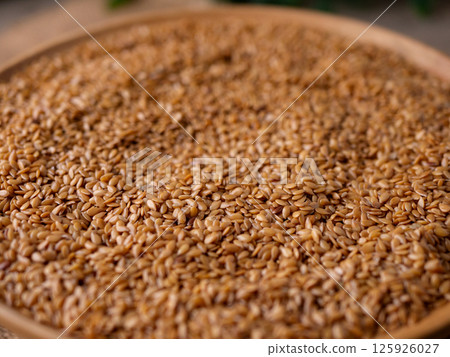 Organic golden flaxseed, linseed grains. Superfood high in fiber. Organic golden flaxseed, linseed grains. Superfood high in fiber. 125926027