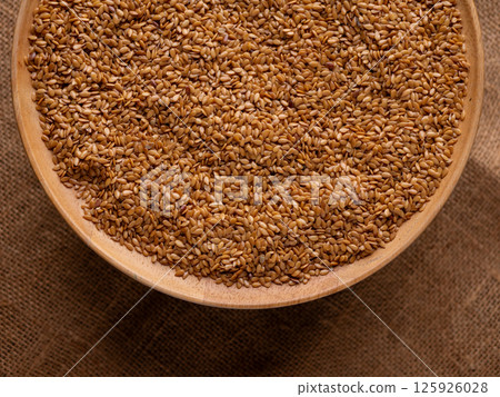 Organic golden flaxseed, linseed grains. Superfood high in fiber. Organic golden flaxseed, linseed grains. Superfood high in fiber. 125926028