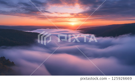 Morning sun shining above the sea of clouds 125926669