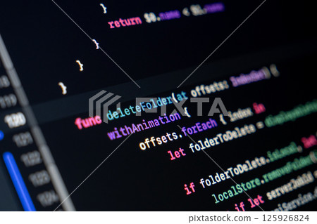 Swift function code on screen showing folder deletion logic with animation and loop structure Swift function code on screen showing folder deletion logic with animation and loop structure 125926824