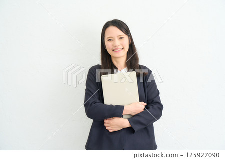 A woman with long hair wearing a jacket 125927090