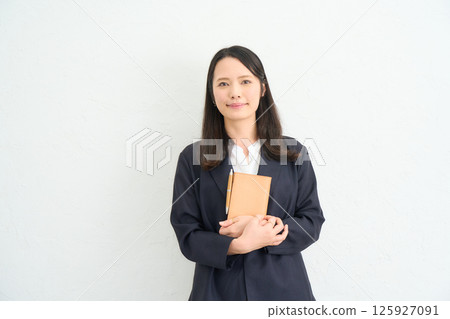 A woman with long hair wearing a jacket 125927091