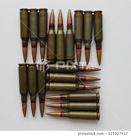 A square with smooth edges made of bullets on a white surface A square with smooth edges made of bullets on a white surface 125927417