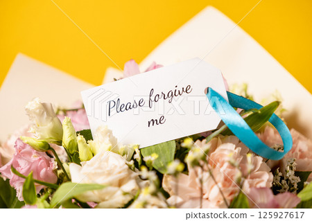 please forgive me message on gift tag with beautiful flower bouquet, heartfelt floral apology for love, friendship, and reconciliation please forgive me message on gift tag with beautiful flower bouquet, heartfelt floral apology for love, friendship, and reconciliation 125927617