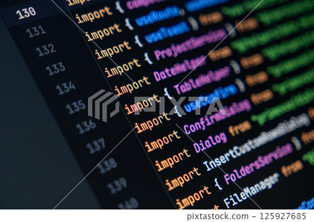 close-up of computer screen with colorful javascript code, focus on import statement, software development and programming 125927685